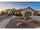 Charming single-story home with desert landscaping and a paved walkway leading to the front door at 20506 N 271St Ave, Buckeye, AZ 85396