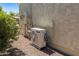 Image shows a Samsung HVAC unit installed on a gravel bed outside of a desert home at 20506 N 271St Ave, Buckeye, AZ 85396