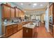 Well-designed kitchen with wood cabinets, granite counters, and a central island at 20506 N 271St Ave, Buckeye, AZ 85396