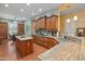Spacious kitchen features custom cabinets, granite countertops, stainless steel appliances and central island at 20506 N 271St Ave, Buckeye, AZ 85396