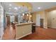 Well-equipped kitchen with wood cabinets, granite counters, and stainless steel appliances at 20506 N 271St Ave, Buckeye, AZ 85396