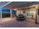 Outdoor patio featuring a seating area with a grill, complemented by a pergola and subtle lighting at 20506 N 271St Ave, Buckeye, AZ 85396