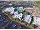 Overhead view of a recreation center showcasing the pool, clubhouse, and ample parking, inviting leisure and enjoyment at 21218 N Aurora Dr, Sun City West, AZ 85375