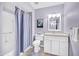 Bathroom with a single sink vanity, toilet, and shower/tub combo with lavender-color walls at 21218 N Aurora Dr, Sun City West, AZ 85375