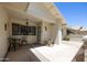Inviting front porch sitting area with a decorative security door and room for seating at 21218 N Aurora Dr, Sun City West, AZ 85375