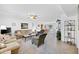 Spacious living room with neutral tones, ceiling fan, and an open floor plan at 21218 N Aurora Dr, Sun City West, AZ 85375