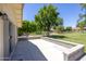 Exterior patio is ready for entertaining with a beautiful yard view in the background at 21218 N Aurora Dr, Sun City West, AZ 85375