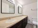 Bright bathroom with double sink vanity, framed mirrors, and modern fixtures at 233 E Cairo Dr, Tempe, AZ 85282
