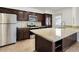 Well-equipped kitchen with stainless steel appliances, granite counters, and custom cabinetry at 233 E Cairo Dr, Tempe, AZ 85282