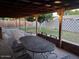 Outdoor covered patio with a dining table at 233 E Cairo Dr, Tempe, AZ 85282