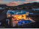 High-angle view of the backyard featuring a pool, hot tub, and outdoor seating areas, ideal for luxury living at 2609 W Lavitt Ln, Phoenix, AZ 85086