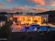 Inviting backyard with a pool, spa, fire pit, and covered patio, perfect for outdoor entertaining at 2609 W Lavitt Ln, Phoenix, AZ 85086