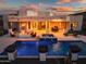 Beautiful backyard with a pool, spa, outdoor seating, desert landscaping, and mountain views at 2609 W Lavitt Ln, Phoenix, AZ 85086