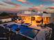 Beautiful backyard with a pool, spa, outdoor seating, desert landscaping, and mountain views at 2609 W Lavitt Ln, Phoenix, AZ 85086