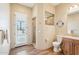 Bright bathroom with a walk-in shower, exterior access, and wood-look tile flooring at 2609 W Lavitt Ln, Phoenix, AZ 85086