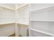 Large closet with shelving and hanging rods perfect for organization and storage at 2609 W Lavitt Ln, Phoenix, AZ 85086