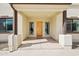 Inviting front entrance with a wood door, decorative sidelights, and covered porch at 2609 W Lavitt Ln, Phoenix, AZ 85086