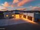 Stunning desert home featuring a large driveway and a spacious three-car garage at 2609 W Lavitt Ln, Phoenix, AZ 85086
