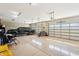 Spacious three car garage featuring ample room for parking and storage with epoxy flooring at 2609 W Lavitt Ln, Phoenix, AZ 85086
