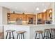 Eat-in kitchen with breakfast bar and stainless steel appliances in a bright space at 2609 W Lavitt Ln, Phoenix, AZ 85086