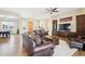 Spacious living room with hardwood floors, comfortable seating, and abundant natural light at 2609 W Lavitt Ln, Phoenix, AZ 85086