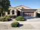 Charming single-story home featuring a two-car garage and well-maintained desert landscaping at 2611 E San Paulo Dr, Casa Grande, AZ 85194