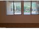 Bright living room featuring horizontal blinds, allowing natural light to illuminate the space at 2611 E San Paulo Dr, Casa Grande, AZ 85194