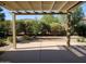 Covered patio area looks out to a secluded backyard space with mature landscaping for outdoor enjoyment at 2611 E San Paulo Dr, Casa Grande, AZ 85194