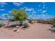 Expansive backyard with desert landscaping, patio, and fencing at 2807 W Gregory St, Apache Junction, AZ 85120