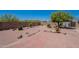 Spacious backyard with brick-lined patio and desert landscaping at 2807 W Gregory St, Apache Junction, AZ 85120