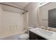 Bathroom featuring a shower and tub combo plus a dark colored vanity at 2807 W Gregory St, Apache Junction, AZ 85120