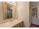 Bathroom featuring a sink with light colored vanity and decorative mirror at 2807 W Gregory St, Apache Junction, AZ 85120