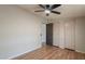 Bedroom with wood floor, ceiling fan, white walls and two large closets at 2807 W Gregory St, Apache Junction, AZ 85120