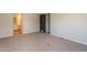 Bedroom with carpeted floors, white walls and an ensuite bathroom at 2807 W Gregory St, Apache Junction, AZ 85120
