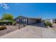 Charming single-story home with covered parking and well-maintained desert landscaping at 2807 W Gregory St, Apache Junction, AZ 85120