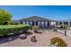 Cozy home with neat desert landscaping, trimmed shrubs, and a covered parking area at 2807 W Gregory St, Apache Junction, AZ 85120