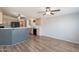 Open floorplan with kitchen featuring wood cabinets, a breakfast bar, and modern appliances at 2807 W Gregory St, Apache Junction, AZ 85120