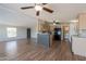 Bright kitchen features an island with seating and modern appliances, with adjacent dining area at 2807 W Gregory St, Apache Junction, AZ 85120