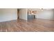 View of the open living area with updated floors, flowing into the kitchen space at 2807 W Gregory St, Apache Junction, AZ 85120