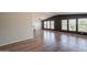 Inviting living space with lots of natural light, high ceiling, and updated wood floors at 2807 W Gregory St, Apache Junction, AZ 85120