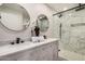 Bathroom features a walk-in shower with marble-style tiles and dual sinks at 2905 W Campo Bello Dr, Phoenix, AZ 85053