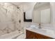 Elegant bathroom featuring marble tile, modern fixtures, and a stylish vanity with sink at 2905 W Campo Bello Dr, Phoenix, AZ 85053