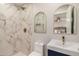 Bathroom features a walk-in shower with marble-style tiles and unique mirrors at 2905 W Campo Bello Dr, Phoenix, AZ 85053