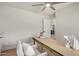 Bright bedroom or office space featuring wood floors, neutral colors, and natural light at 2905 W Campo Bello Dr, Phoenix, AZ 85053