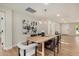 Dining room featuring a modern light fixture, wood table, and neutral color palette at 2905 W Campo Bello Dr, Phoenix, AZ 85053