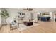 Open-concept living room with modern furnishings and views into the updated kitchen at 2905 W Campo Bello Dr, Phoenix, AZ 85053