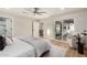 Bedroom features sliding glass doors, ceiling fan, and light wood floors at 2905 W Campo Bello Dr, Phoenix, AZ 85053