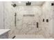 This shower features marble-style tiles, dual shower heads and a built-in niche at 2905 W Campo Bello Dr, Phoenix, AZ 85053