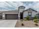 Charming single-Gathering home showcasing a well-manicured lawn and neutral color palette at 2923 W Shanley Ave, Apache Junction, AZ 85120