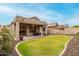 Spacious backyard showcasing a well-maintained lawn and covered patio area at 3022 W Redwood Ln, Phoenix, AZ 85045